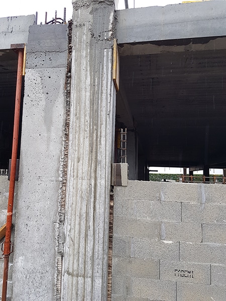 Joint de dilation & désolidarisation des murs du RDC par rapport à la structure poteaux poutres